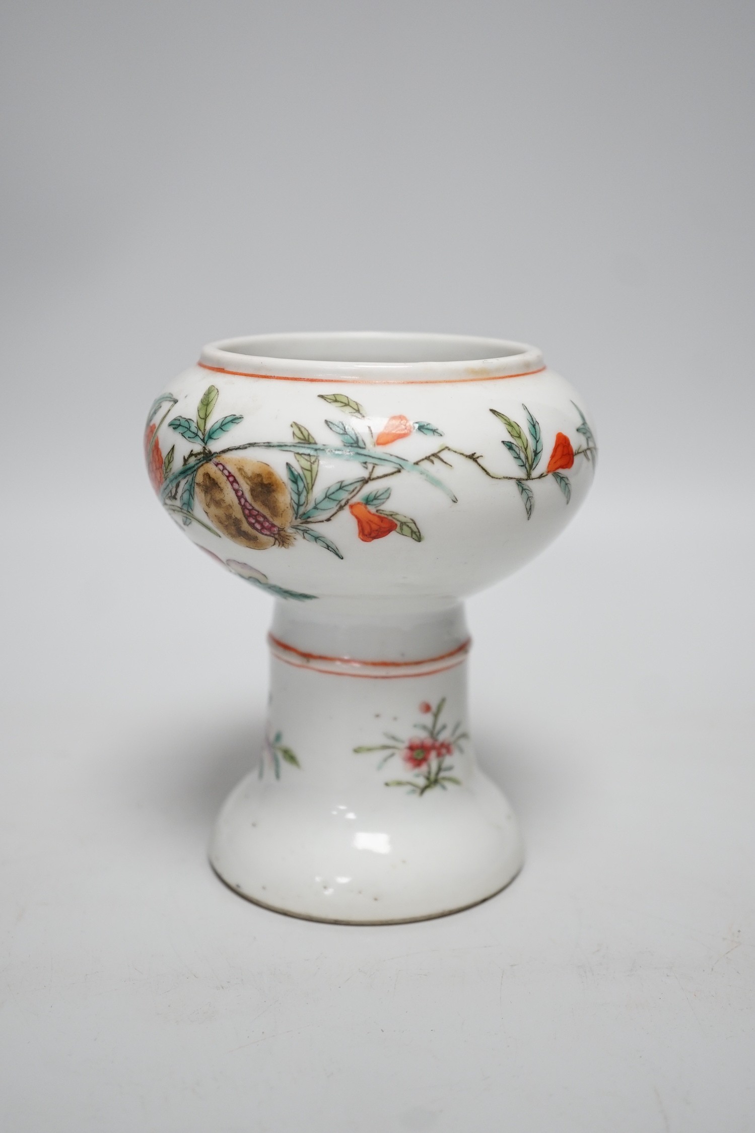 A 19th century Chinese stem cup, painted with flowers and fruit 12cm